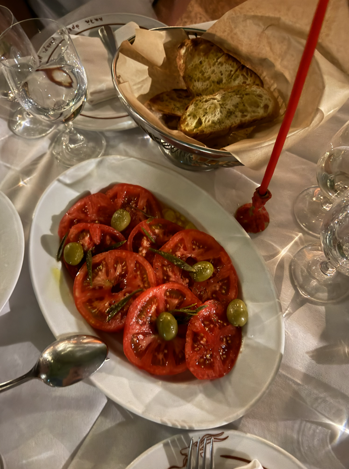 Tomato salad and bread on a dinner table